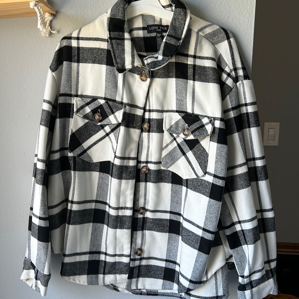 Thick black and white buffalo print sweater.